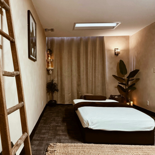 Massage room with ladder decor at Emerald Healing Center